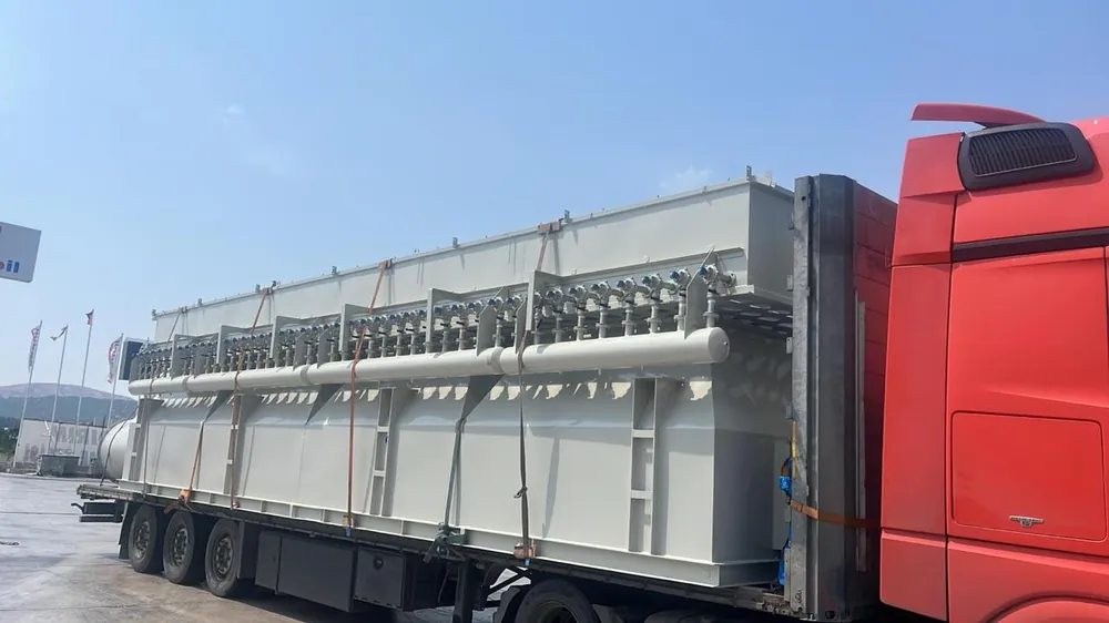 Worker loading cargo pallets for transport